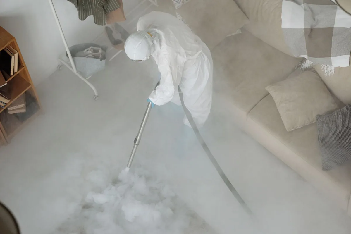 Biohazard cleanup technician in protective equipment, Sumrall, MS